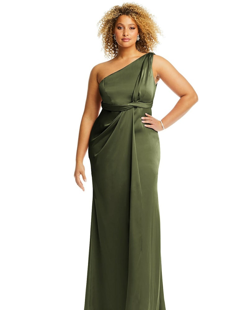 Front of a model wearing a size 20W One-Shoulder Draped Twist Empire Waist Trumpet Gown in Olive Green by Dessy Collection. | dia_product_style_image_id:267116